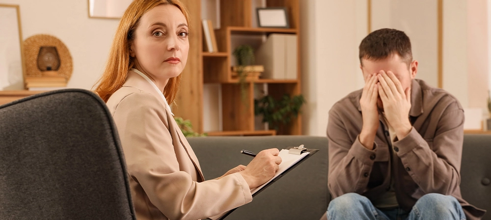 Female psychologist working with drug addict in office