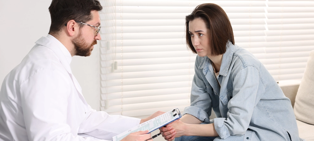 alcoholic woman having appointment with healthcare specialist in clinic. Addiction treatment